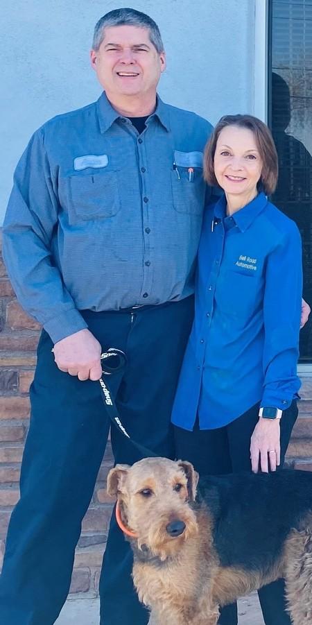 Owners of Bell Road Automotive in Phoenix with their dog